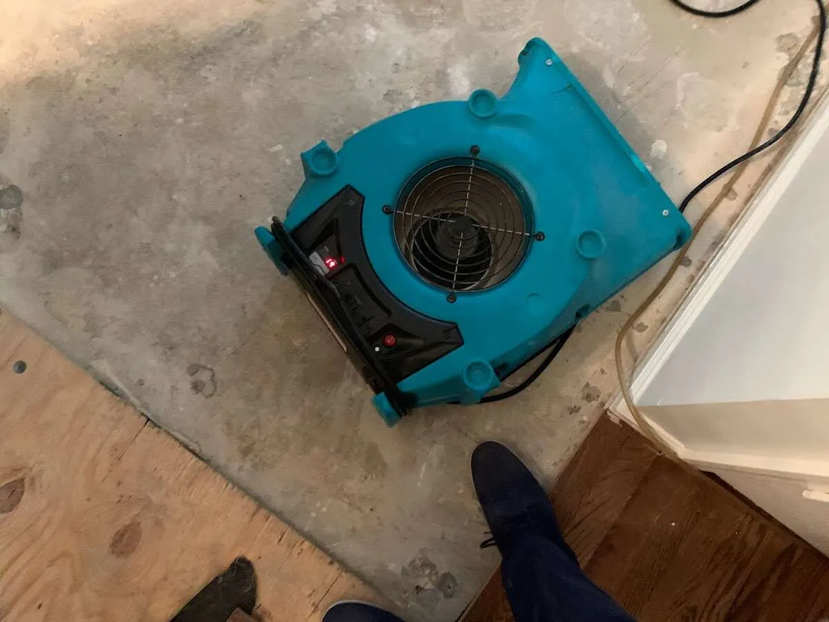 Air mover drying subfloor during Leak Detection & Repair in Hot Springs